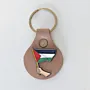 Handmade Leather Keychain with Hand Holding the Palestine Flag