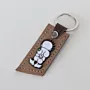 Natural Leather Keychain with Handala Character and Flower on Long Tag