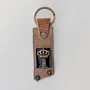 Leather Keychain with Gold Crown on Long Tag Handcrafted Design