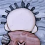 Handala-Inspired Brown Stone Mosaic Wall Art
