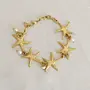 Contemporary Bracelet in cultured pearl with star detail