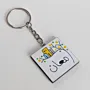 Personalized Wooden Arabic Name Keychain with Yellow Starburst - 4 x 4 cm