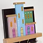 Handmade Wooden Wall Key Holder with Colorful Houses on Black Backdrop Design