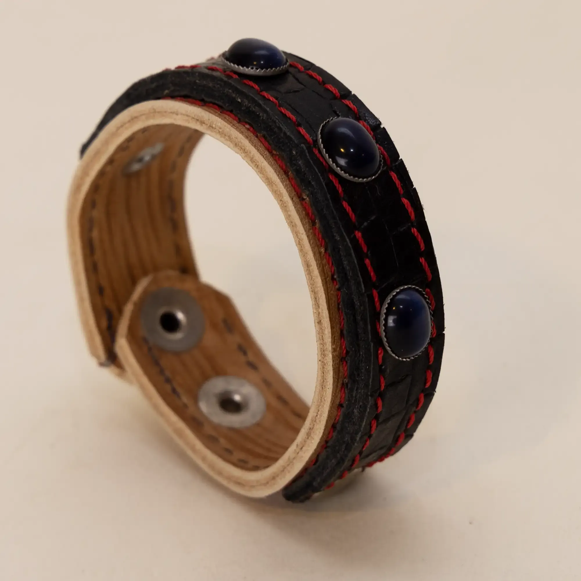 Handcrafted Black with Red Stitching and Dark Stones Bracelet