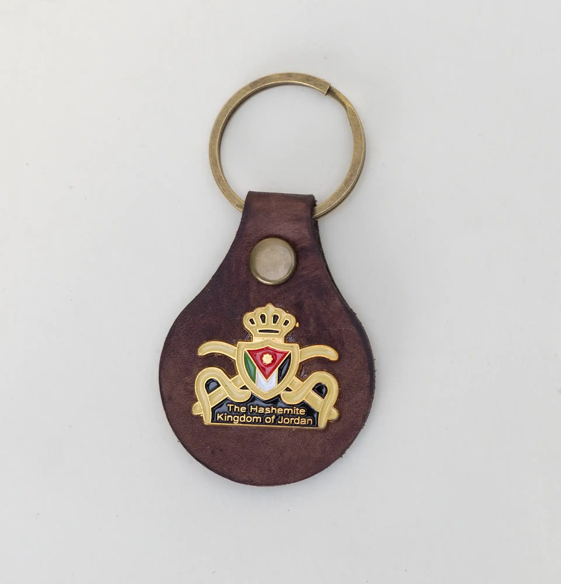Natural Leather Keychain with Gold Crown Emblem Artisan Design