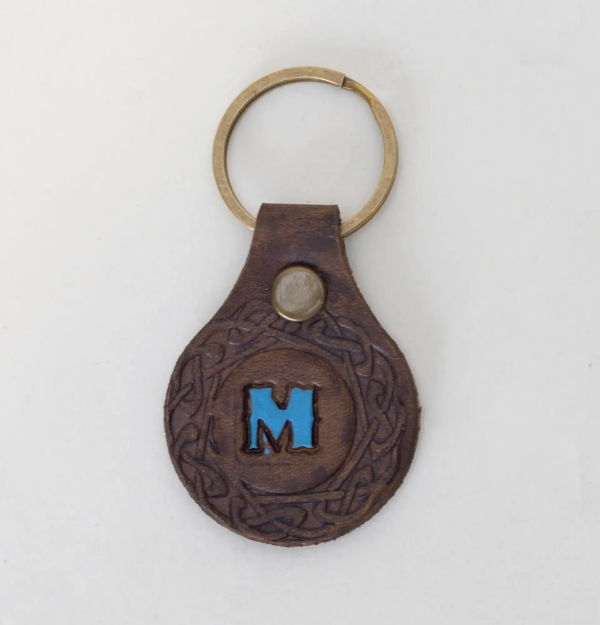 Leather Keychain with Blue Letter M Emblem Handcrafted Design