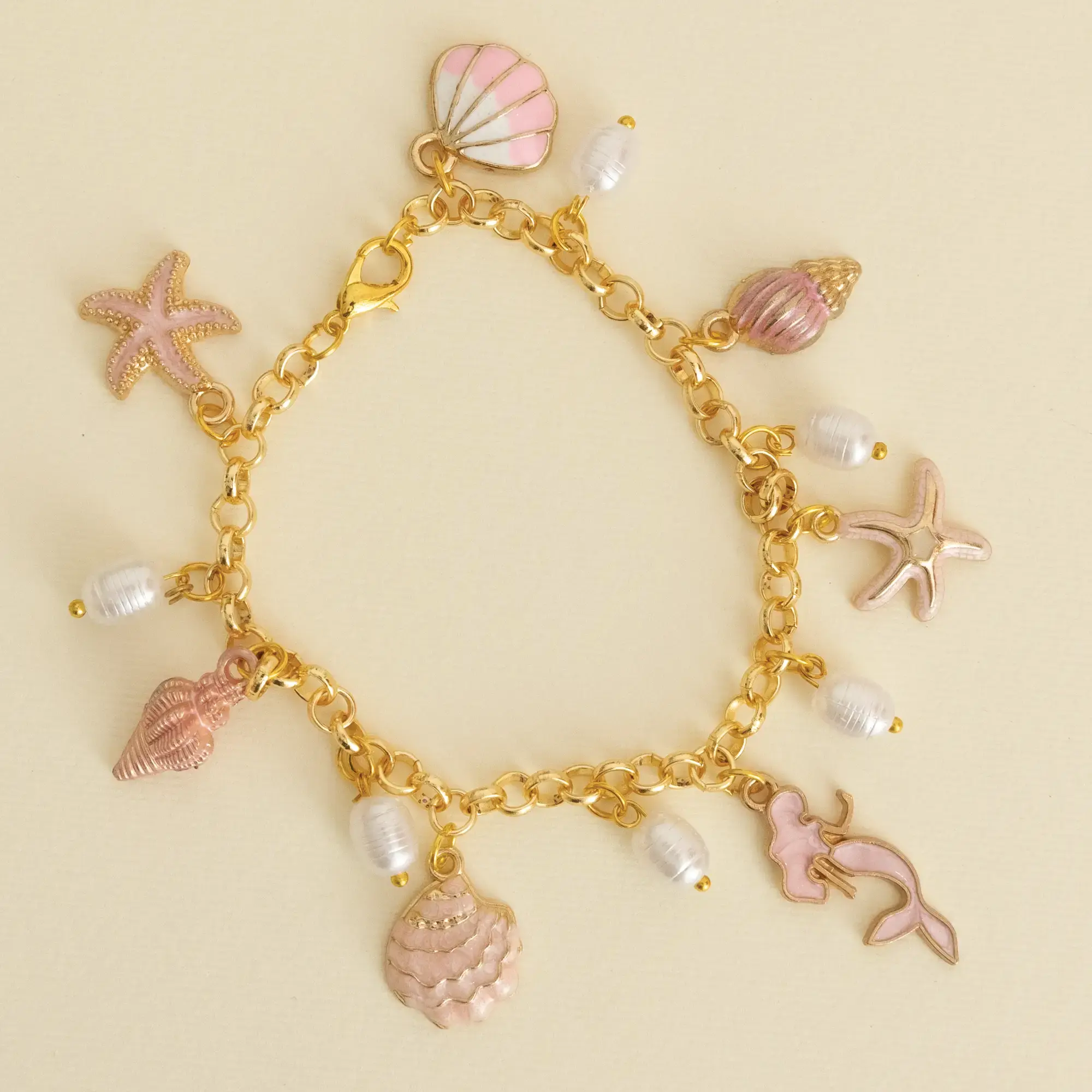 Handcrafted Pink and Ivory Sea Charm Bracelet with Distinctive Detail