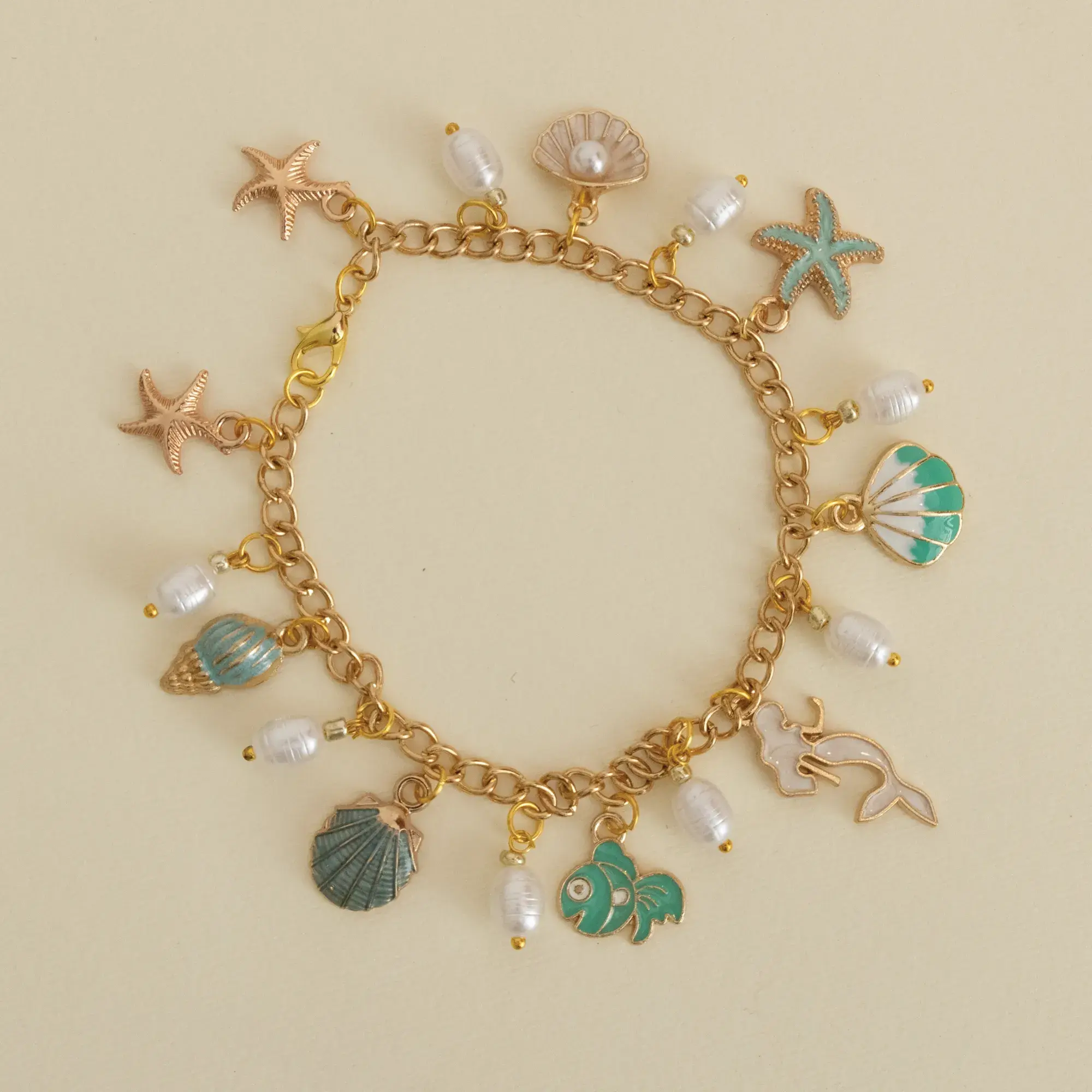 Handcrafted Ivory and Mint Sea Charm Bracelet with Distinctive Detail