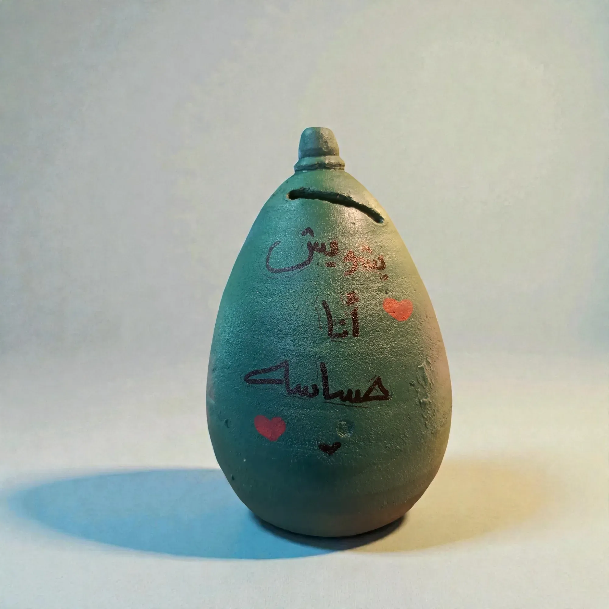 Hand-Painted Teal Green Clay Piggy Bank with Travel Quote 17x12 cm