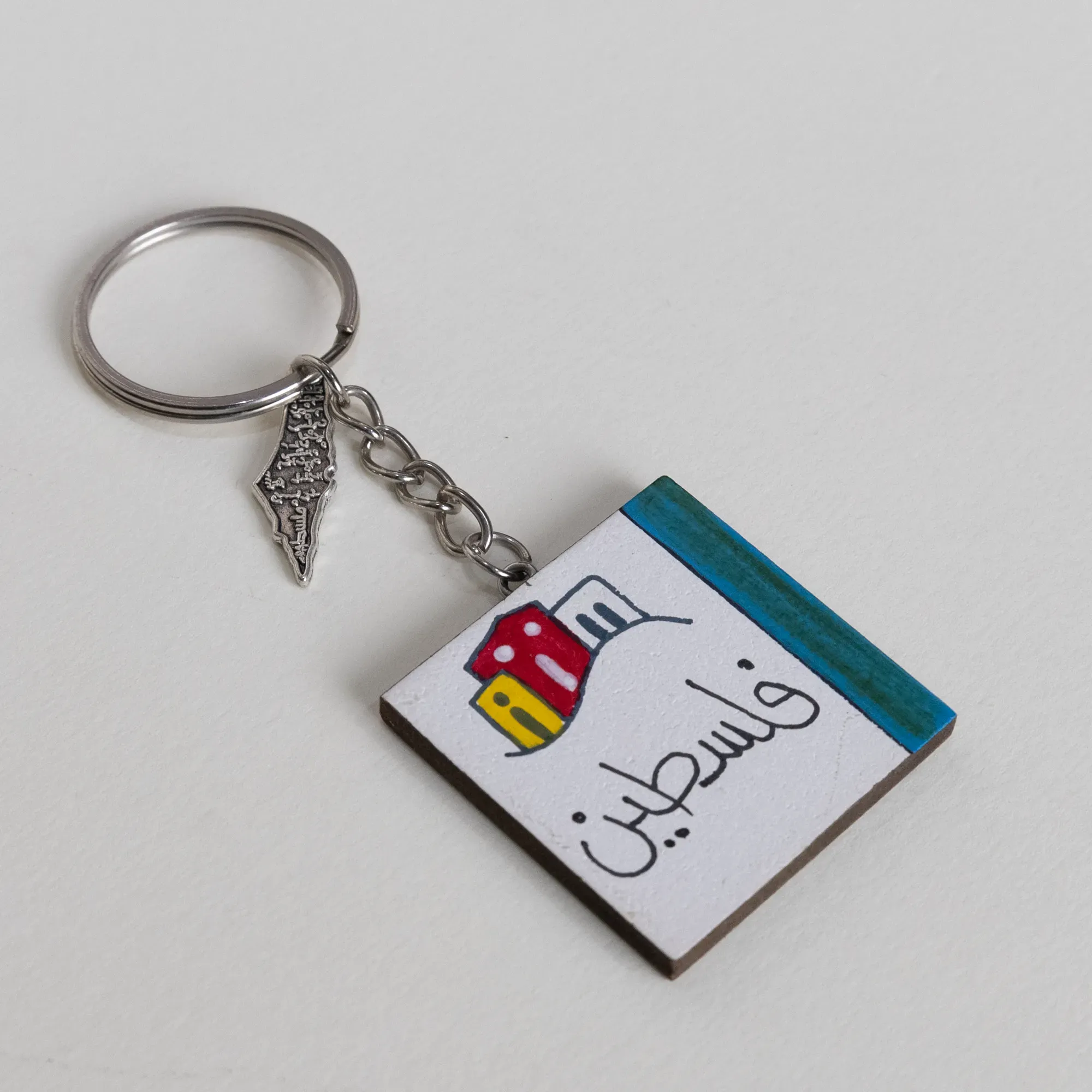 Personalized Wooden Arabic Name Keychain with Red Green City Stripe - 4 x 4 cm