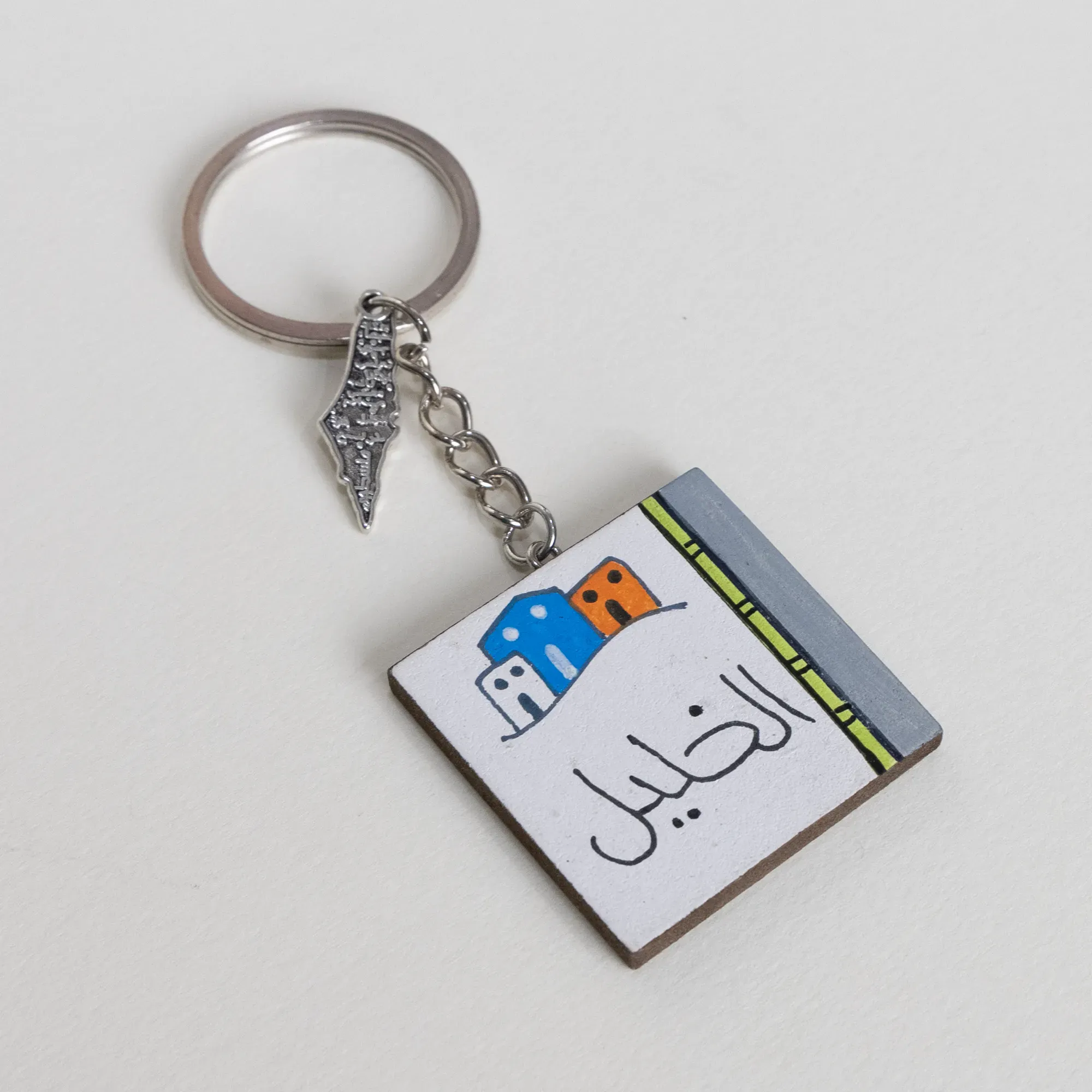 Personalized Wooden Arabic Name Keychain with Blue Yellow Skyline - 4 x 4 cm