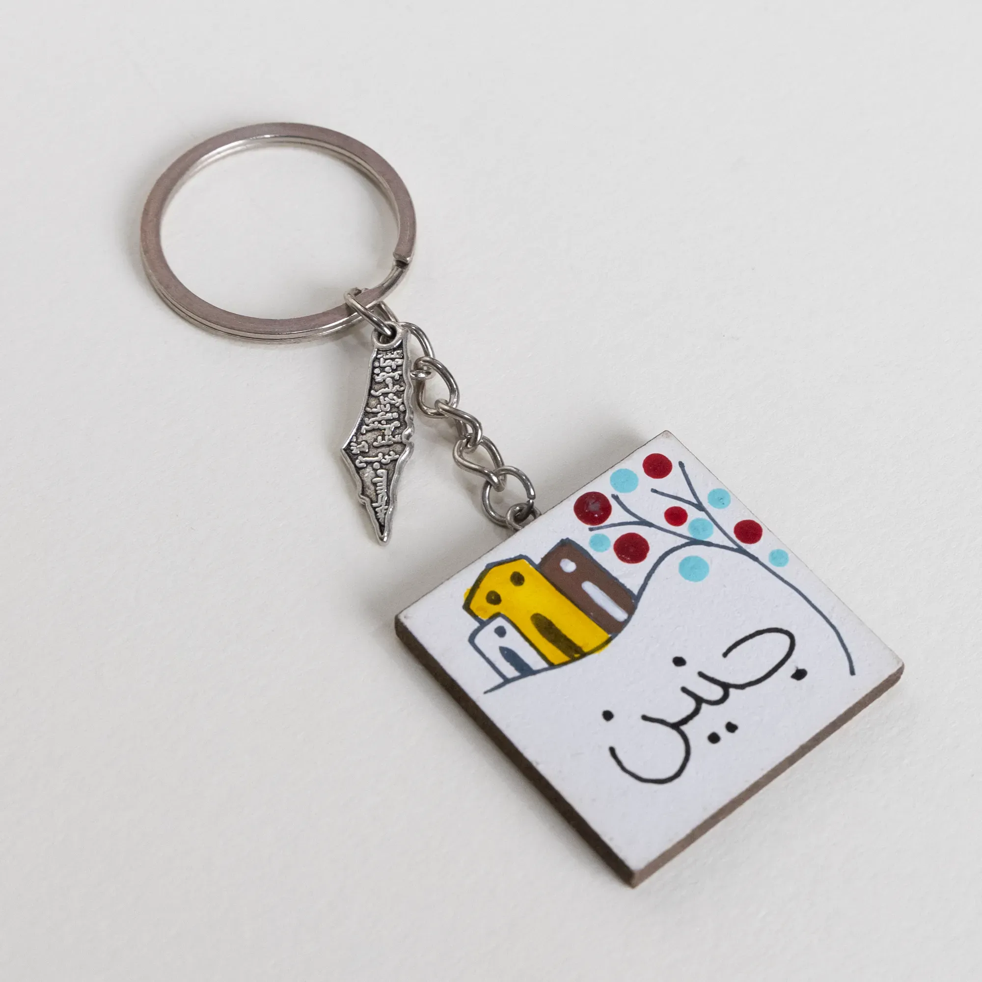 Personalized Wooden Arabic Name Keychain with Red Blue Dot Border - 4 x 4 cm
