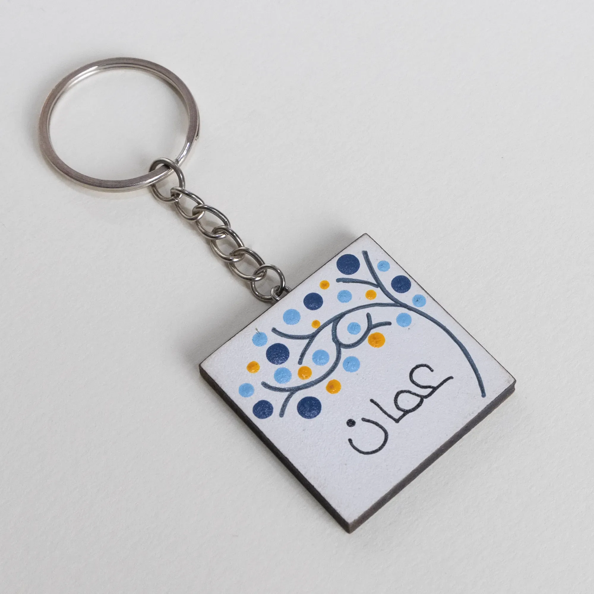 Personalized Wooden Arabic Name Keychain with Blue Yellow Dot Arc - 4 x 4 cm