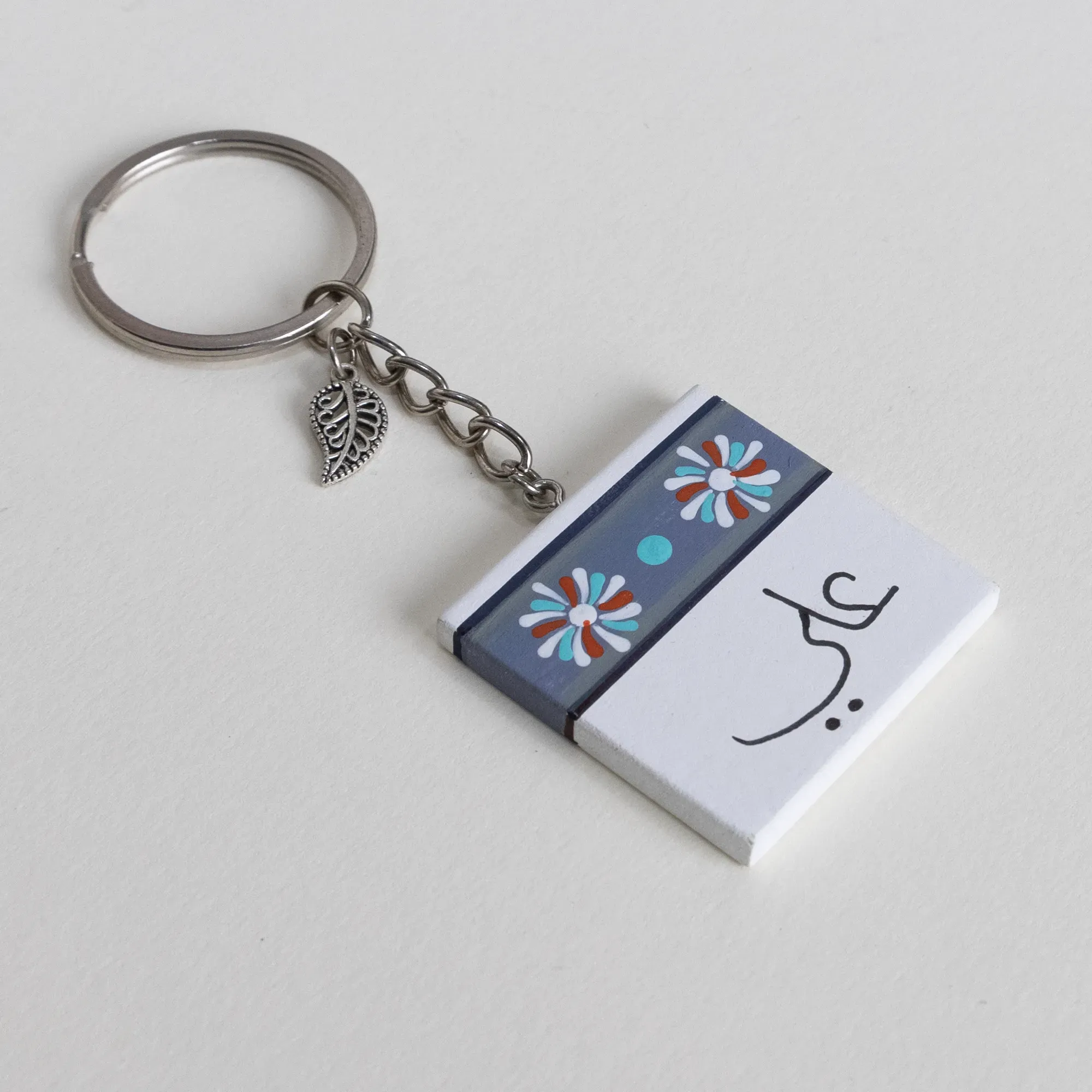 Personalized Wooden Arabic Name Keychain with Ali Grey Floral - 4 x 4 cm