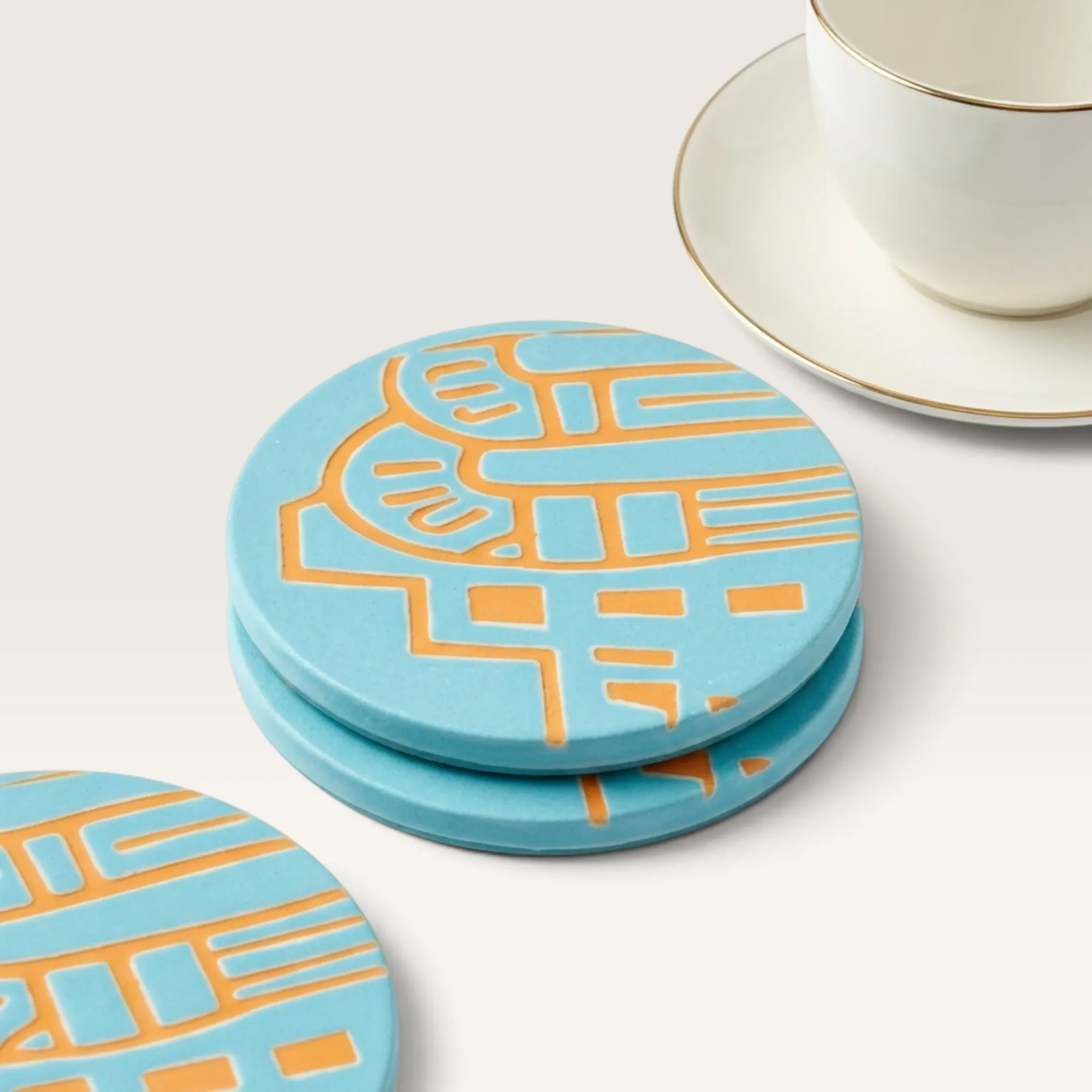 Round Turquoise Ceramic Coaster with Heritage Carving