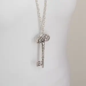 Contemporary Necklace in copper, silver-plated metal with Key of Return detail