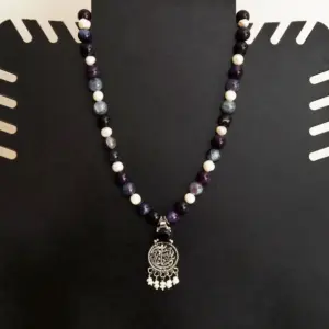 Contemporary Necklace in pearl, lapis lazuli, copper with floral detail