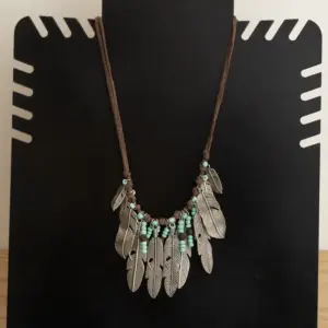 Contemporary Necklace in turquoise, beads with leaf detail