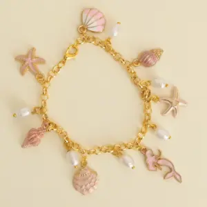 Handcrafted Pink and Ivory Sea Charm Bracelet with Distinctive Detail