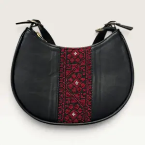 Black Half-Moon Shoulder Bag with red geometric heritage panel, 25 x 17 cm